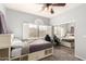 Well-lit bedroom showcasing a bed, mirrored closet, and view of the surrounding scenery at 16256 S 1St St, Phoenix, AZ 85048