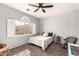 Bedroom featuring neutral walls, window with shutters and view, and a ceiling fan at 16256 S 1St St, Phoenix, AZ 85048
