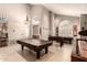 Bright game room featuring tile floors, pool table, foosball table, and ample space at 16256 S 1St St, Phoenix, AZ 85048