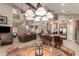 Open-concept living room and kitchen with lots of natural light and pendant lighting in neutral tones at 16256 S 1St St, Phoenix, AZ 85048