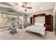 Comfortable main bedroom with a Murphy bed, exercise equipment, and natural light at 16256 S 1St St, Phoenix, AZ 85048