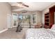Comfortable main bedroom with a Murphy bed, exercise equipment, and natural light at 16256 S 1St St, Phoenix, AZ 85048