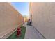 A narrow side yard featuring a paver walkway and artificial turf is functional and low maintenance at 16256 S 1St St, Phoenix, AZ 85048