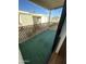 The balcony has artificial turf and a decorative wood panel fence at 16635 N Cave Creek Rd # 213, Phoenix, AZ 85032