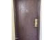 A front door featuring an electronic lock and a gold-colored handle at 16635 N Cave Creek Rd # 213, Phoenix, AZ 85032