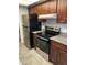 Modern kitchen featuring stainless steel oven and refrigerator appliances at 16635 N Cave Creek Rd # 213, Phoenix, AZ 85032