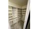 Walk-in pantry featuring shelving for ample storage in the kitchen at 16635 N Cave Creek Rd # 213, Phoenix, AZ 85032
