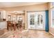 Bright dining area featuring a glass door and a wood dining set at 17708 W Cactus Flower Dr, Goodyear, AZ 85338