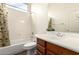 Bathroom featuring a shower/tub combo and vanity at 18261 W Weatherby Dr, Surprise, AZ 85374