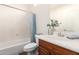 Bathroom featuring a shower/tub combo, a vanity and mirror at 18261 W Weatherby Dr, Surprise, AZ 85374