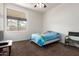 Bedroom featuring carpet floors, a ceiling fan, and natural light at 18261 W Weatherby Dr, Surprise, AZ 85374