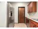Well-equipped kitchen with stainless steel appliances and wood cabinetry at 18261 W Weatherby Dr, Surprise, AZ 85374