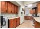 A secondary kitchen offers plentiful cabinet space with a sink and microwave oven at 18261 W Weatherby Dr, Surprise, AZ 85374