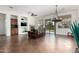 Open-concept living room with a fireplace, built-in shelving, and a sliding door to the outdoor space at 18261 W Weatherby Dr, Surprise, AZ 85374