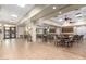Spacious meeting room with tables, chairs, and a light and airy atmosphere at 18261 W Weatherby Dr, Surprise, AZ 85374