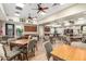 Well-lit meeting room with tables, chairs, and a warm, inviting ambiance at 18261 W Weatherby Dr, Surprise, AZ 85374