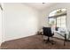 Office featuring carpet floors, natural lighting, and space for a desk and chair at 18261 W Weatherby Dr, Surprise, AZ 85374