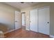 Neutral bedroom boasts wood floors, closet and hallway access at 18807 N 1St Ave, Phoenix, AZ 85027