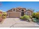 Charming single-story home featuring a neutral color palette, a two-car garage, and a well-manicured front yard at 18807 N 1St Ave, Phoenix, AZ 85027