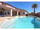 Stunning pool with a covered patio, ample deck space, and lush landscaping creates a perfect retreat at 1915 E Citation Ln, Tempe, AZ 85284