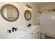 Bathroom featuring double sinks with modern fixtures and a shower-tub combo at 1915 E Citation Ln, Tempe, AZ 85284