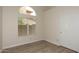 An empty bedroom with a window and a closet at 1915 E Citation Ln, Tempe, AZ 85284