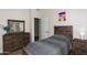 Bedroom featuring a bed, dresser with mirror, and nightstand at 1915 E Citation Ln, Tempe, AZ 85284