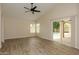 Bright and airy bedroom with wood-look flooring and a sliding glass door leading to the pool area at 1915 E Citation Ln, Tempe, AZ 85284