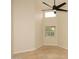 Neutral bedroom featuring a modern ceiling fan, window, and tile flooring at 1915 E Citation Ln, Tempe, AZ 85284