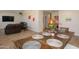 Dining area with hardwood floors, table settings, and access to other living spaces at 1915 E Citation Ln, Tempe, AZ 85284