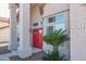 Close-up of a red double-door entrance with striking pillars and desert landscaping creating a welcoming facade at 1915 E Citation Ln, Tempe, AZ 85284