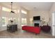 Spacious living room boasts high ceilings, abundant natural light, a stone fireplace, and views of the outdoor pool at 1915 E Citation Ln, Tempe, AZ 85284