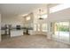 Spacious living area open to the kitchen, offering natural light, and access to the outdoor pool at 1915 E Citation Ln, Tempe, AZ 85284