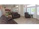 Inviting living room with hardwood floors, plantation shutters, and an open floor plan at 1915 E Citation Ln, Tempe, AZ 85284