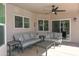 Cozy outdoor patio with stylish seating, a ceiling fan, and ample space for relaxation and social gatherings at 1915 E Citation Ln, Tempe, AZ 85284