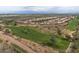 Panoramic aerial view of the community showcasing the lush golf course and desert landscape at 19185 N 116Th Ln, Surprise, AZ 85378