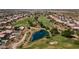 Aerial view of the golf course community, highlighting the community lake at 19185 N 116Th Ln, Surprise, AZ 85378