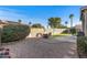 Private backyard with decorative gravel, patio, artificial lawn and desert landscaping at 19185 N 116Th Ln, Surprise, AZ 85378