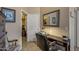 Bedroom featuring a work space and view into the walk-in closet at 19185 N 116Th Ln, Surprise, AZ 85378