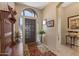 Welcoming foyer with tiled floor, coat rack, and views to adjacent living spaces at 19185 N 116Th Ln, Surprise, AZ 85378