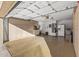 Spacious three-car garage with ample storage and cabinets on the back wall at 19185 N 116Th Ln, Surprise, AZ 85378
