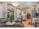 Bright kitchen with white cabinets, stainless steel appliances, and a view into the dining and living areas at 19185 N 116Th Ln, Surprise, AZ 85378
