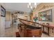 Elegant living room with a grand piano and open floorplan at 19185 N 116Th Ln, Surprise, AZ 85378