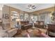 Bright living room featuring an open floorplan and comfortable furnishings at 19185 N 116Th Ln, Surprise, AZ 85378