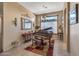 Elegant living area featuring a piano, chandelier, and window seat at 19185 N 116Th Ln, Surprise, AZ 85378