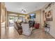 Comfortable living room with a ceiling fan, tv, and access to outdoor patio at 19185 N 116Th Ln, Surprise, AZ 85378