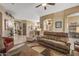 Warm and inviting living room with tiled floors and open design concept at 19185 N 116Th Ln, Surprise, AZ 85378
