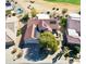 This aerial view shows solar panels and landscaping for a beautiful home near a golf course at 20113 N Lagos Ct, Surprise, AZ 85374