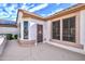 The back exterior showcases a private patio area with stucco walls and well placed windows at 20113 N Lagos Ct, Surprise, AZ 85374