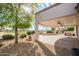 Landscaped backyard features a covered patio and golf course views at 20113 N Lagos Ct, Surprise, AZ 85374
